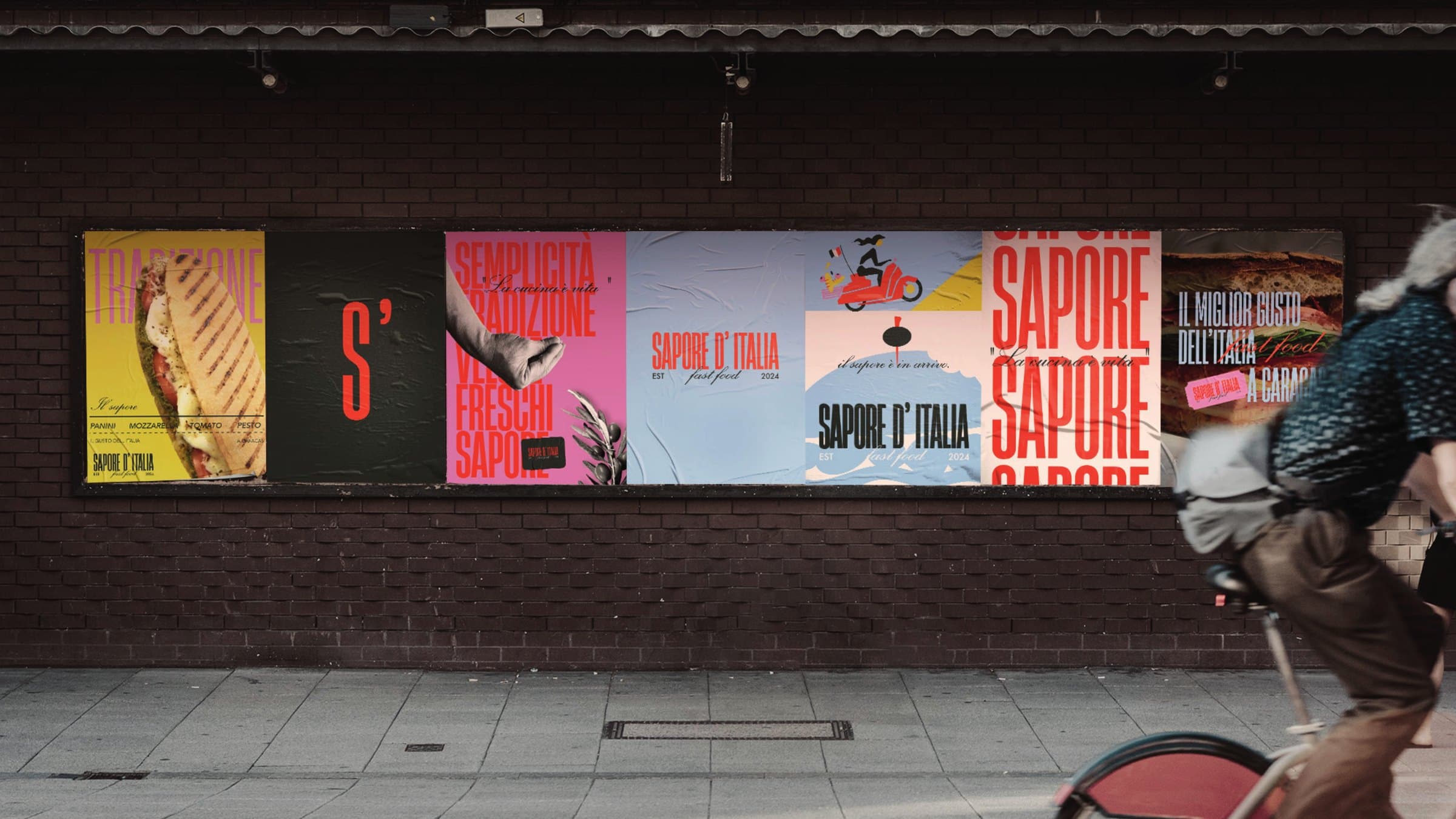 A run of Sapore d'Italia posters pasted on a brick wall in the street